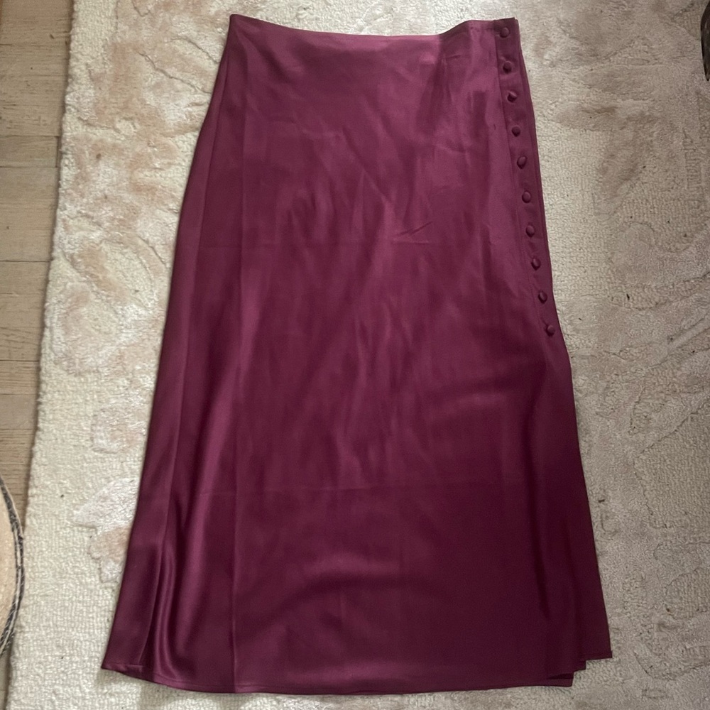 Elegant Plum Skirt with side slit and satin cover side buttons. NWOT